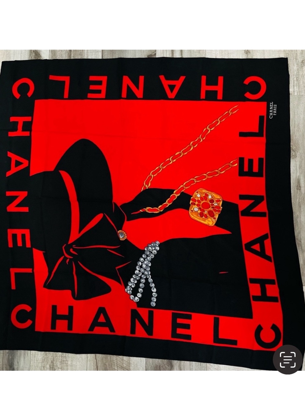 Chanel Mademoiselle silhouette design with pearl and gold chain detail